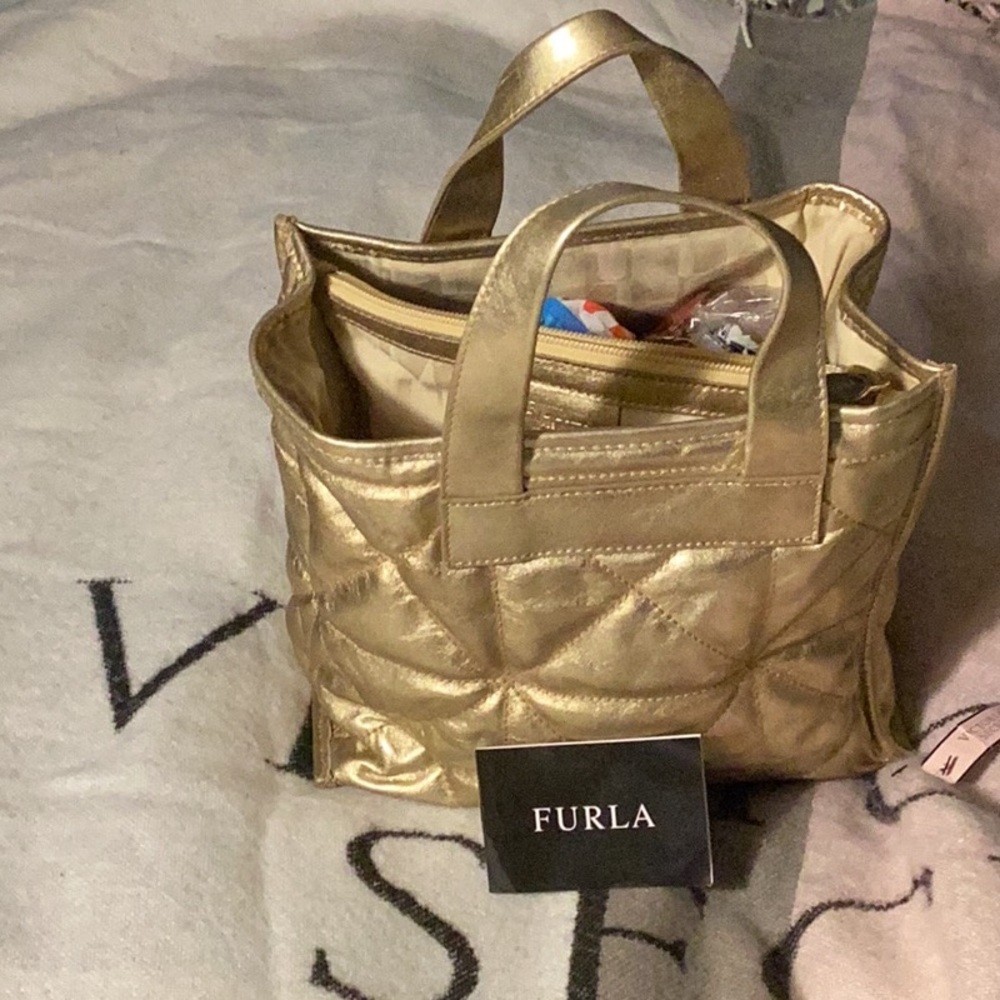 10 x 8 lather gold Furla purse one pocket two handles